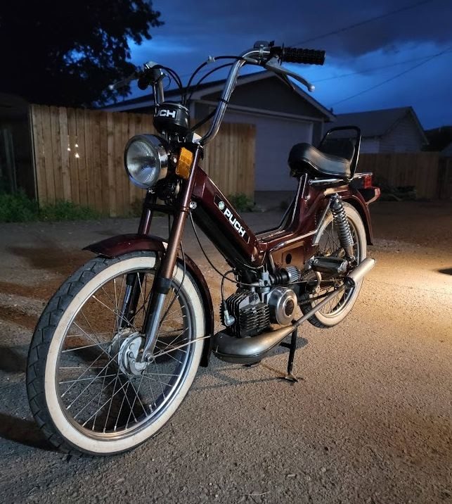 A maroon Puch in the Moped Motel fleet