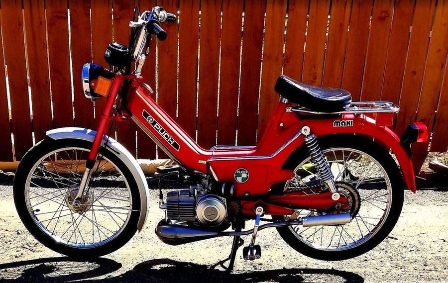 A red Puch in the Moped Motel fleet